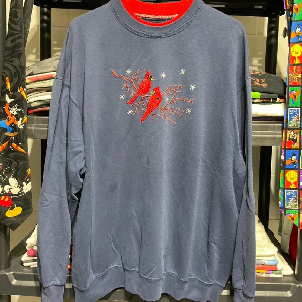 Embroidered cardinal birds on a branch sweatshirt in blue and red